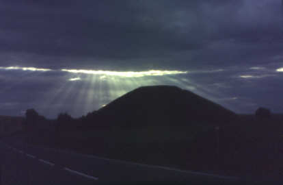 Silbury with Sun breaking through clouds