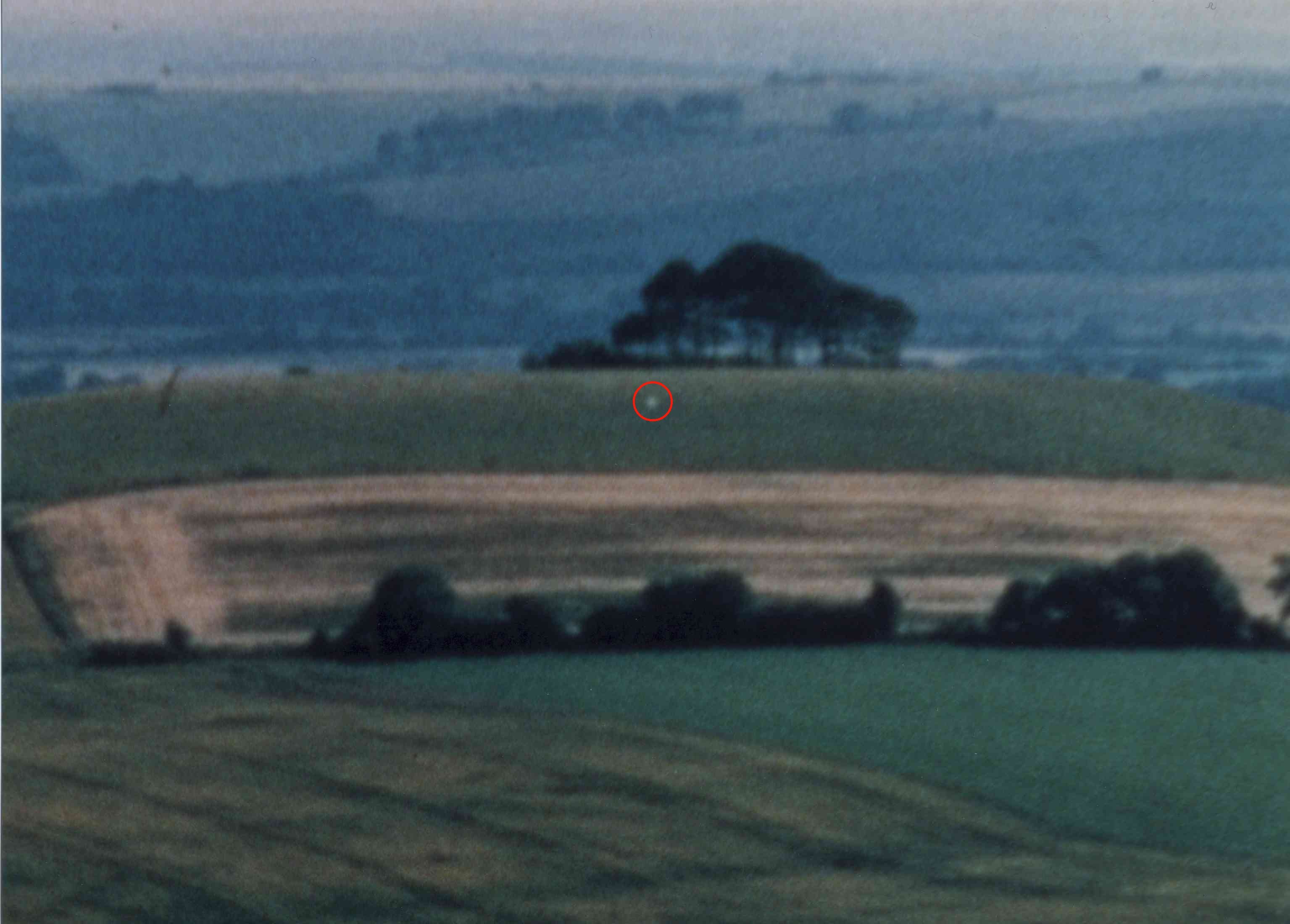 In July 1999, the landing of an unknown flying light was photographed at daylight on Woodborough Hill, Wiltshire, South England.
